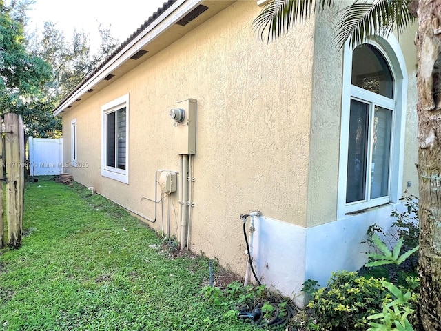 view of property exterior featuring a yard