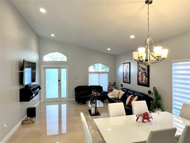 tiled dining room with french doors and a chandelier