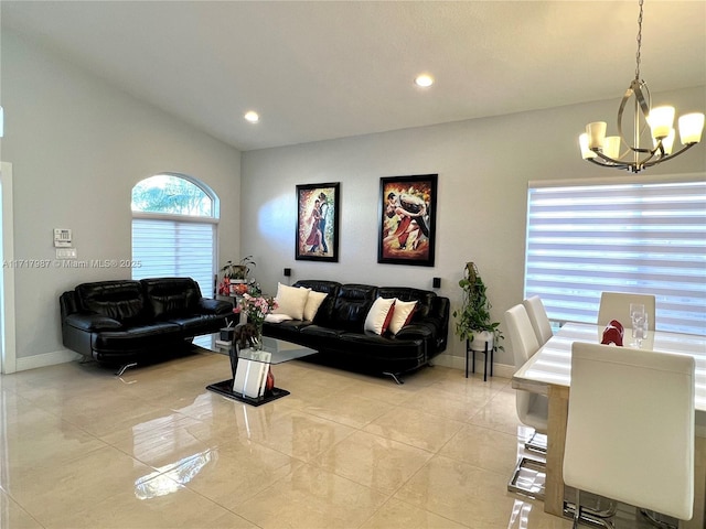 living room with light tile patterned flooring and an inviting chandelier