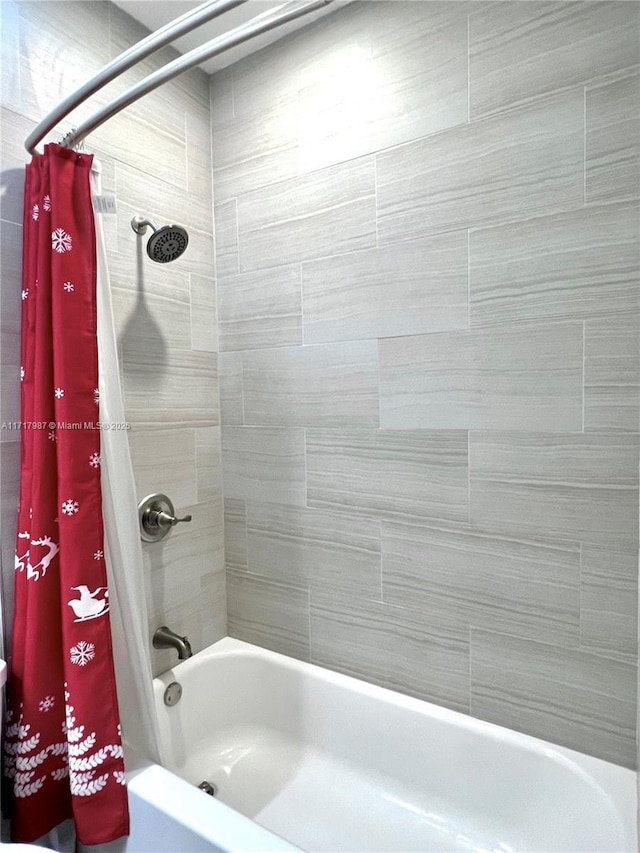 bathroom with shower / tub combo with curtain