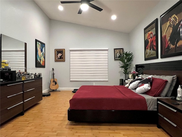 bedroom featuring light wood-type flooring, ceiling fan, and lofted ceiling