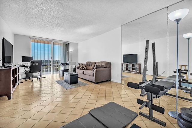 living room featuring a wall of windows, a textured ceiling, and light tile patterned floors