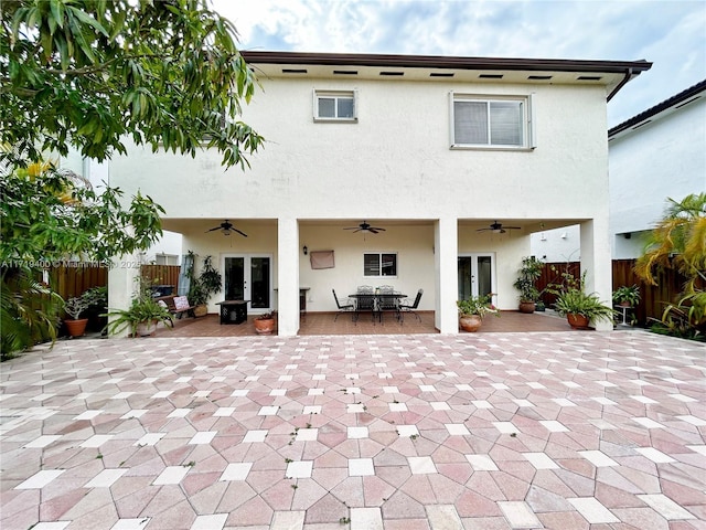 back of property featuring a patio area and ceiling fan