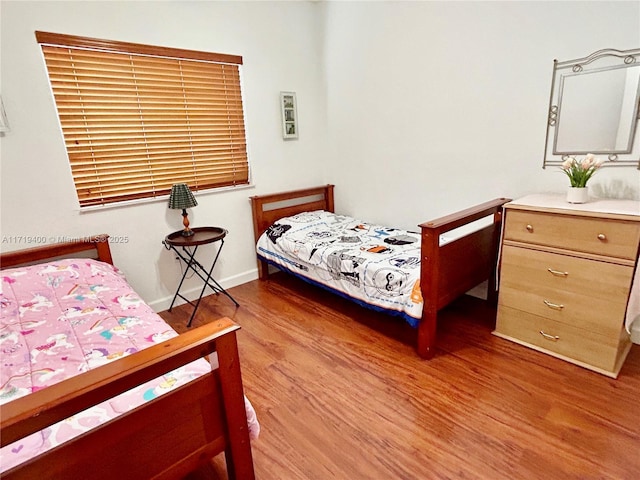 bedroom featuring hardwood / wood-style flooring