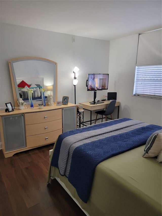 bedroom featuring dark wood-type flooring