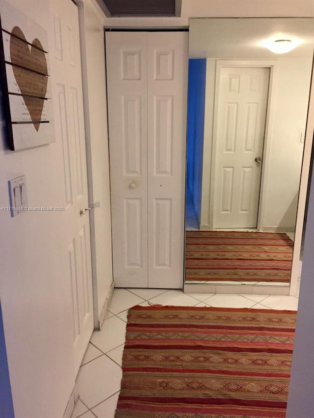 hallway with light tile patterned floors