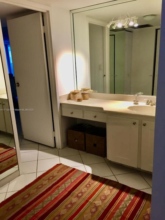 bathroom featuring tile patterned floors and vanity