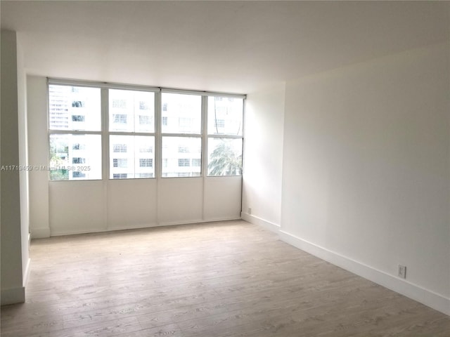 spare room featuring light hardwood / wood-style floors