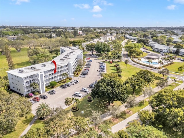 3003 Lyndhurst H Unit 3003, Deerfield Beach, FL 33442 - bird's eye view of a tree filled landscape and a pool area