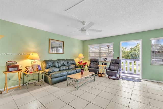 3003 Lyndhurst H Unit 3003, Deerfield Beach, FL 33442 - living room with a textured ceiling, ceiling fan, and light tile patterned floors