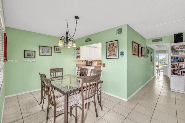 3003 Lyndhurst H Unit 3003, Deerfield Beach, FL 33442 - dining space featuring a chandelier and light tile patterned floors