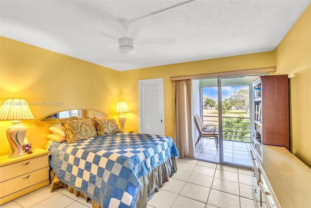 bedroom with light tile patterned floors, access to outside, a closet, and ceiling fan