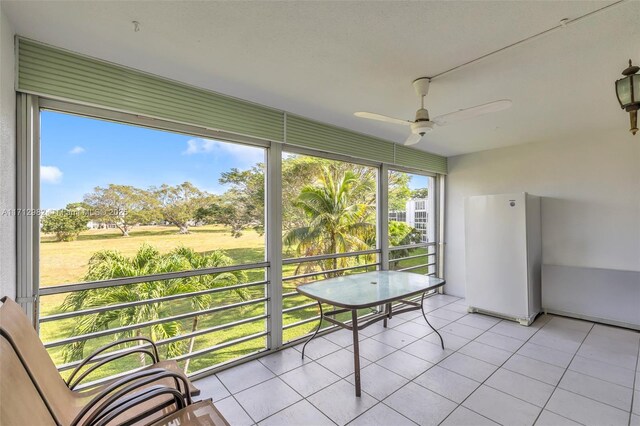 3003 Lyndhurst H Unit 3003, Deerfield Beach, FL 33442 - unfurnished sunroom featuring a ceiling fan