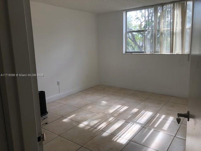 view of tiled empty room