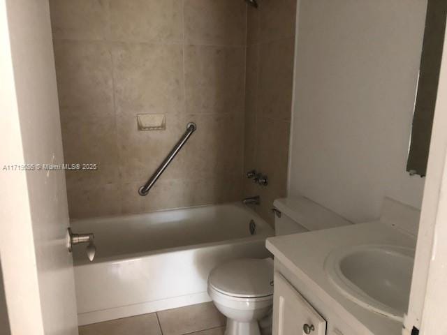 full bathroom with tile patterned flooring, vanity, toilet, and tiled shower / bath