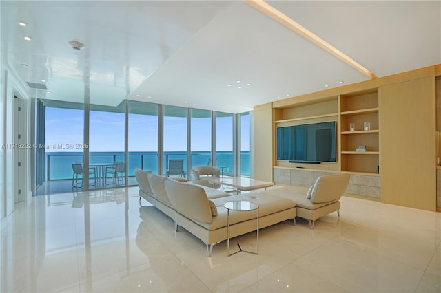 tiled living room with floor to ceiling windows and built in features