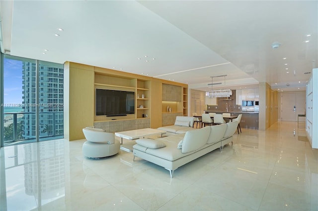 living room featuring built in shelves and expansive windows