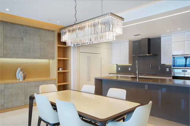 dining area featuring built in shelves and light tile patterned flooring