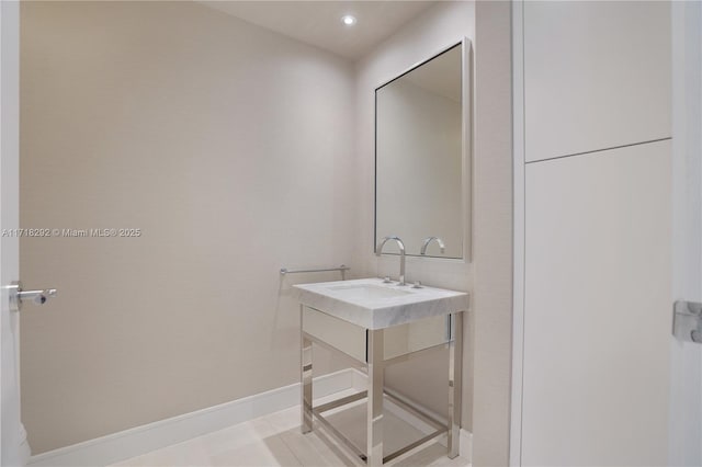 bathroom with tile patterned floors and vanity