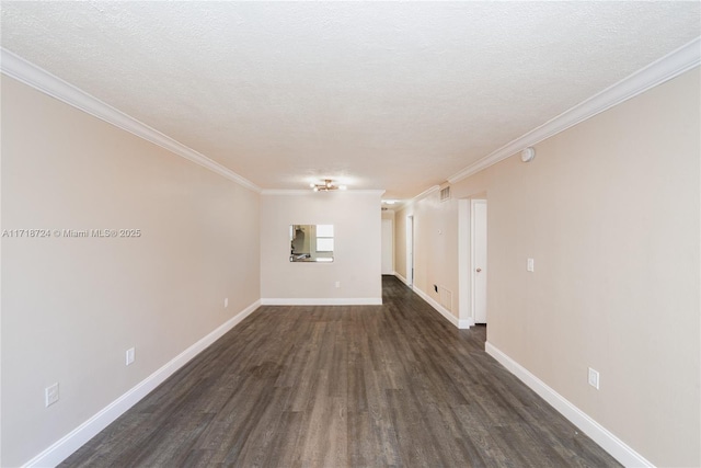 empty room featuring crown molding, dark hardwood / wood-style floors, and a textured ceiling