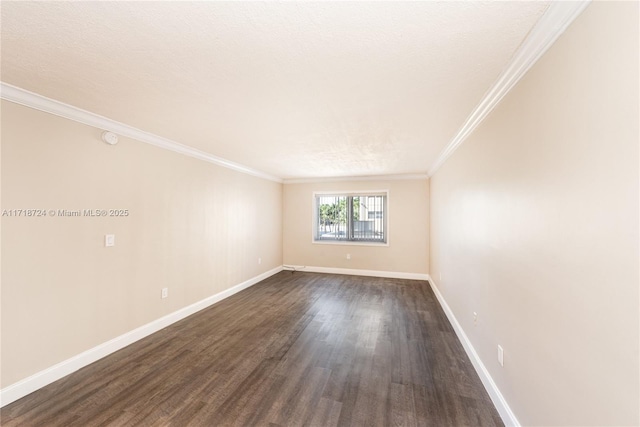 unfurnished room with a textured ceiling, dark hardwood / wood-style floors, and crown molding