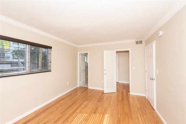 unfurnished bedroom featuring light hardwood / wood-style floors and ornamental molding