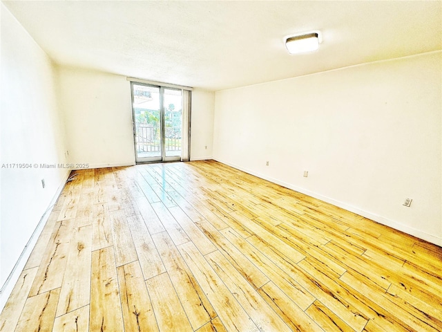 empty room with light wood-type flooring