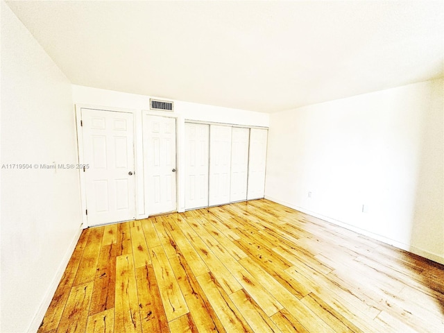 unfurnished bedroom featuring light hardwood / wood-style floors