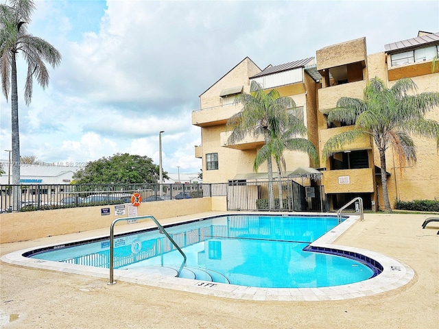 view of swimming pool featuring a patio