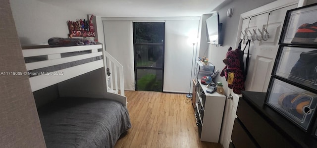 bedroom with light hardwood / wood-style flooring