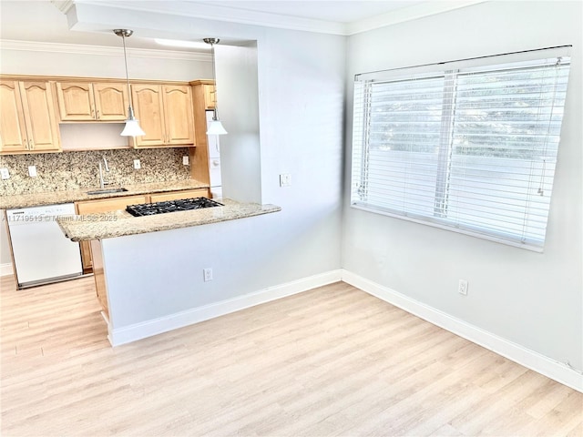 kitchen featuring light brown cabinets, light stone counters, backsplash, white dishwasher, and pendant lighting