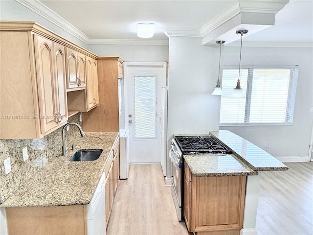 kitchen with dishwasher, sink, stainless steel gas stove, decorative light fixtures, and light stone counters