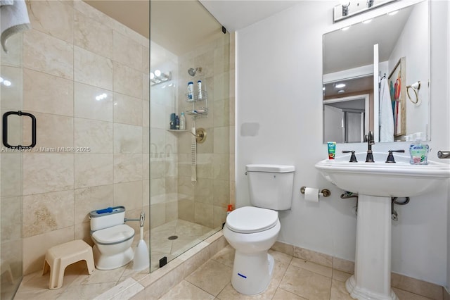 bathroom with an enclosed shower, tile patterned floors, tile walls, and toilet