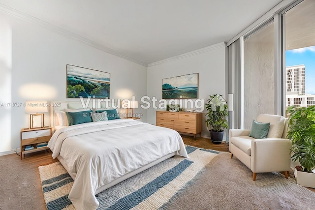 bedroom with ornamental molding and floor to ceiling windows