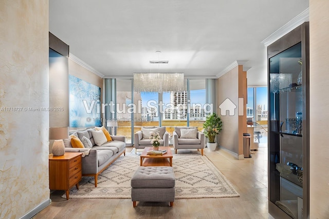 living room with crown molding, wood-type flooring, floor to ceiling windows, and a chandelier