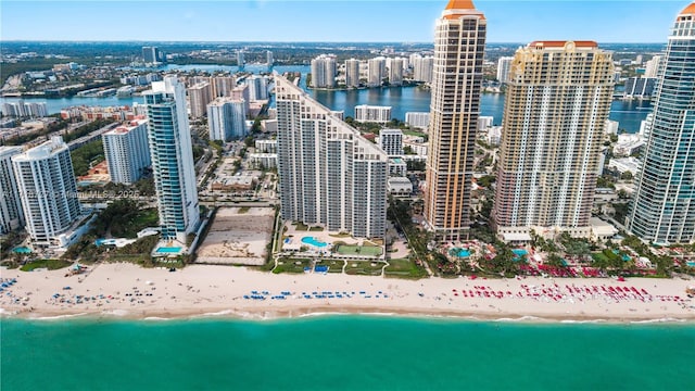 bird's eye view featuring a beach view and a water view