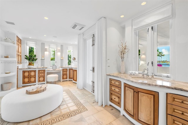 bathroom with a bathtub and vanity