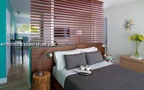 bedroom featuring wood-type flooring