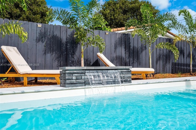 view of pool with pool water feature