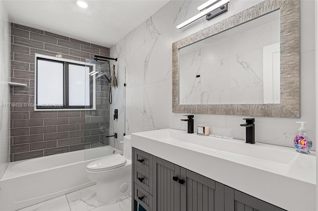 full bathroom with toilet, tiled shower / bath combo, and vanity