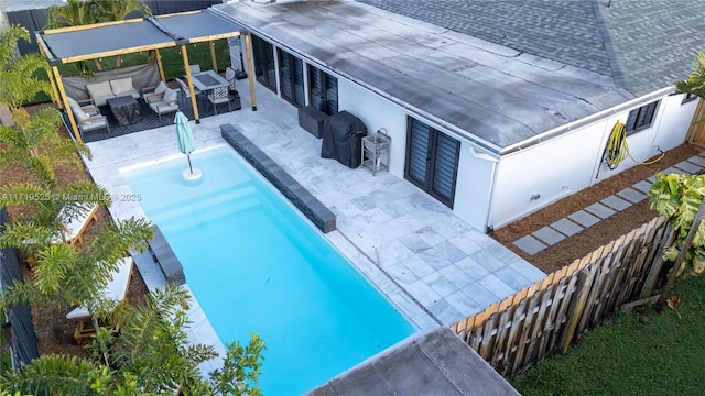 view of swimming pool with an outdoor hangout area, grilling area, and a patio