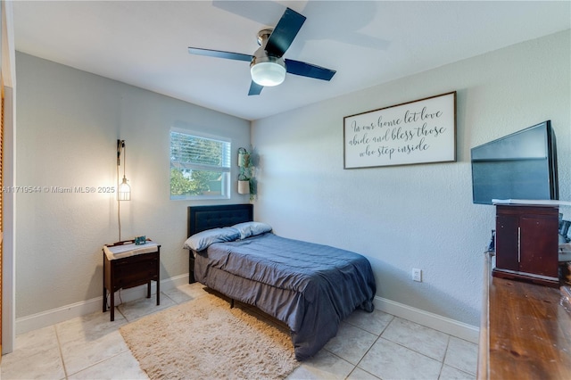 tiled bedroom with ceiling fan