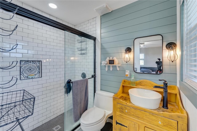 bathroom featuring vanity, toilet, and walk in shower