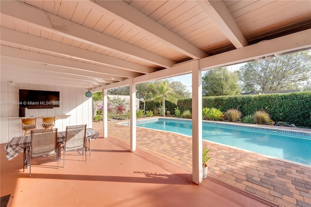 view of swimming pool featuring a patio area