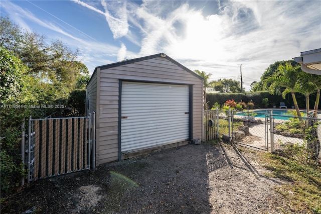 garage featuring a fenced in pool