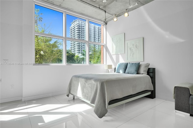 bedroom featuring track lighting