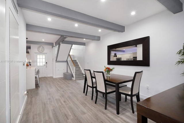 interior space featuring light hardwood / wood-style flooring and beamed ceiling