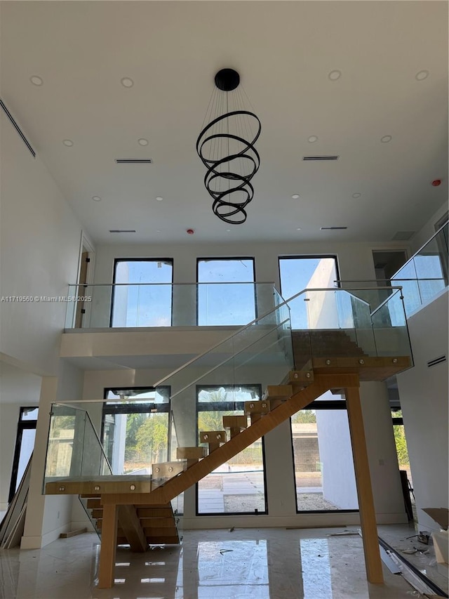 6190 SW 128th St, Pinecrest, FL 33156 - stairs featuring a towering ceiling, plenty of natural light, a chandelier, and recessed lighting