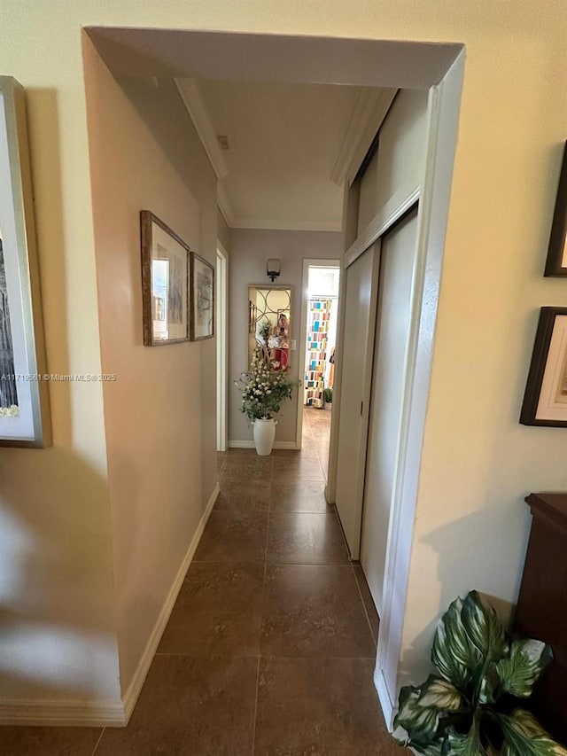 hallway featuring ornamental molding