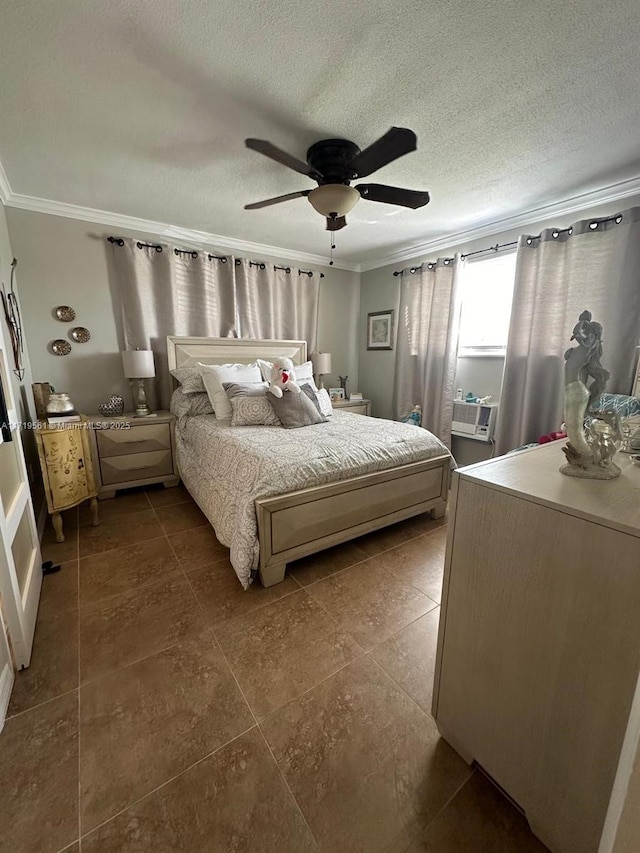 bedroom featuring ceiling fan, a textured ceiling, and ornamental molding